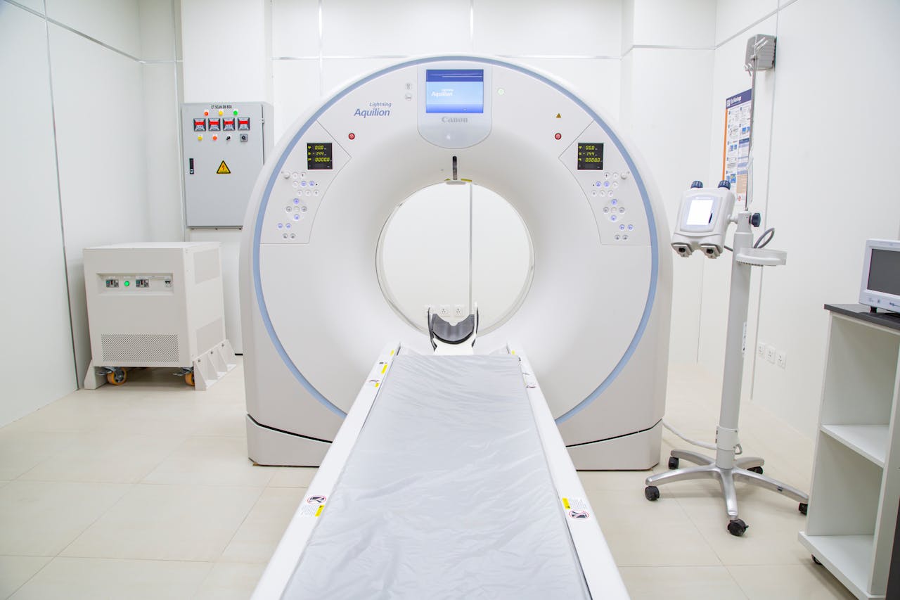 High-quality image of a modern MRI scanner in a sterile hospital room, ready for use.