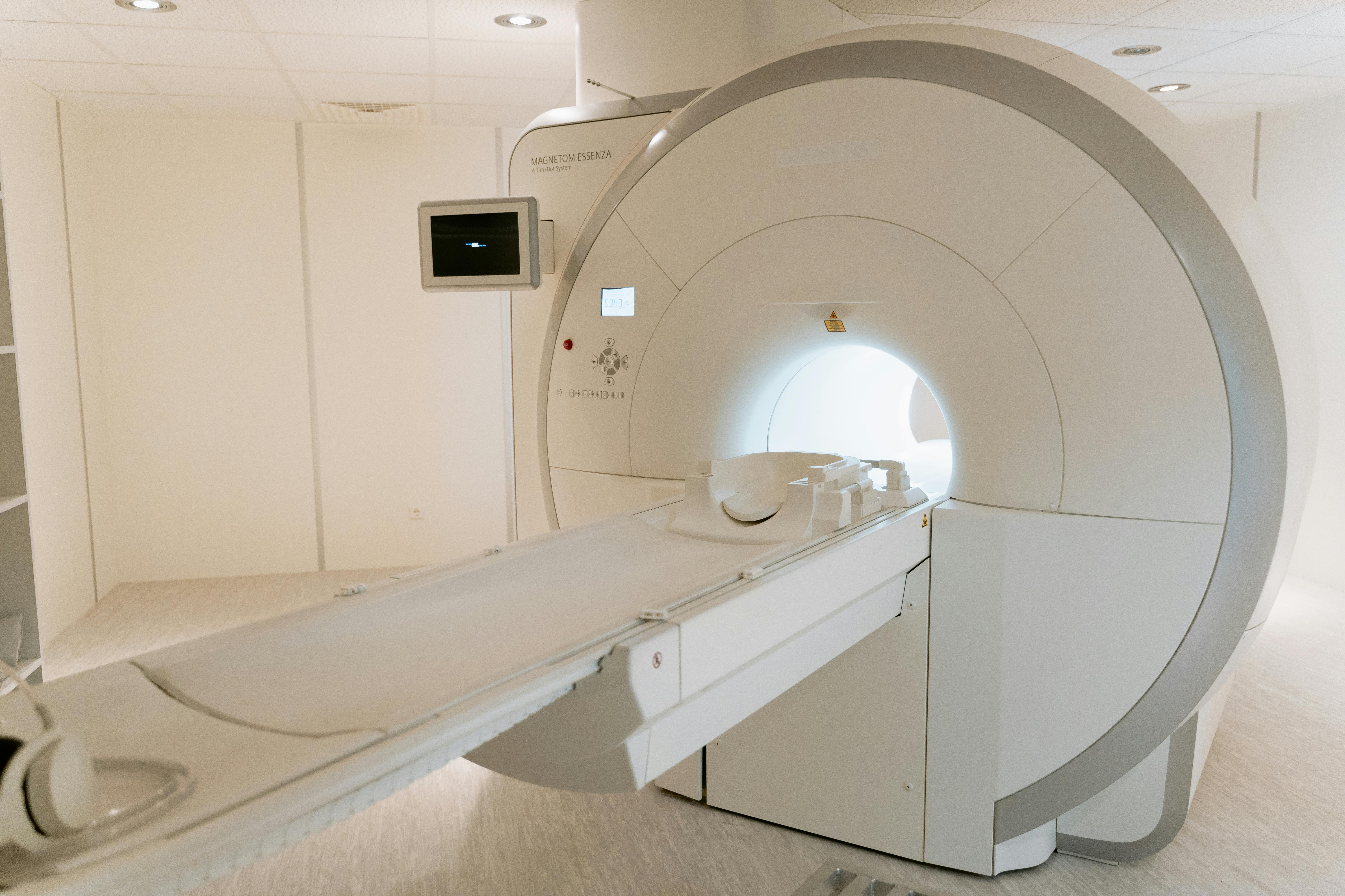 pexels photo 7089017 7089017 A state-of-the-art MRI scanner in a well-lit hospital room, ready for patient use.